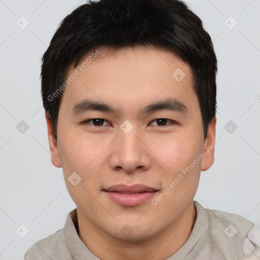 Joyful asian young-adult male with short  black hair and brown eyes