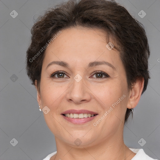 Joyful white adult female with short  brown hair and brown eyes