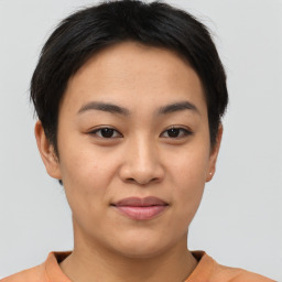 Joyful asian young-adult female with short  brown hair and brown eyes