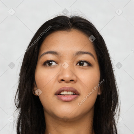 Joyful asian young-adult female with long  brown hair and brown eyes