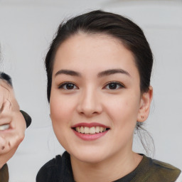 Joyful asian young-adult female with medium  black hair and brown eyes