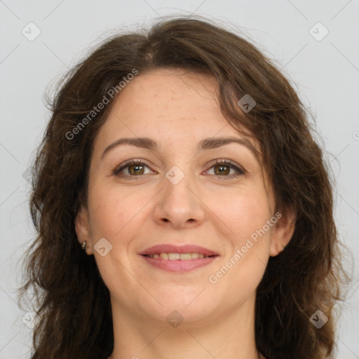 Joyful white adult female with long  brown hair and brown eyes