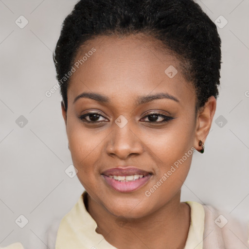 Joyful black young-adult female with short  brown hair and brown eyes