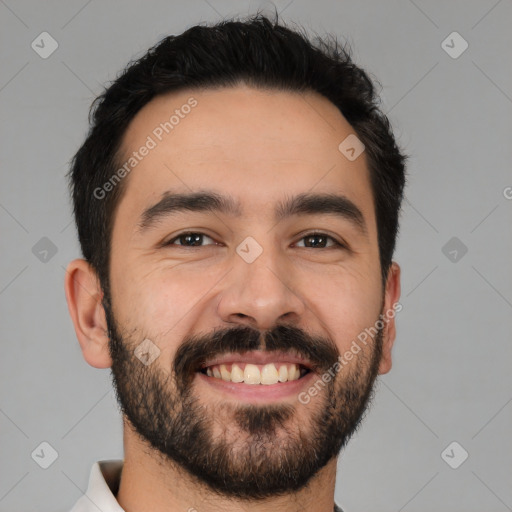 Joyful white young-adult male with short  black hair and brown eyes