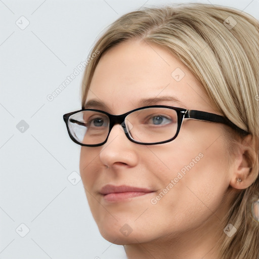 Joyful white young-adult female with long  brown hair and blue eyes