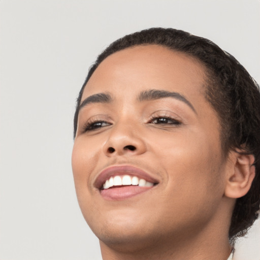 Joyful latino young-adult female with medium  black hair and brown eyes