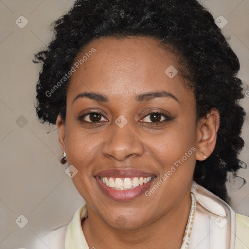 Joyful black adult female with medium  brown hair and brown eyes