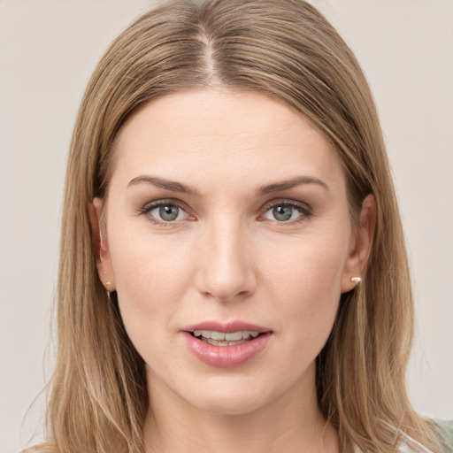 Joyful white young-adult female with long  brown hair and grey eyes