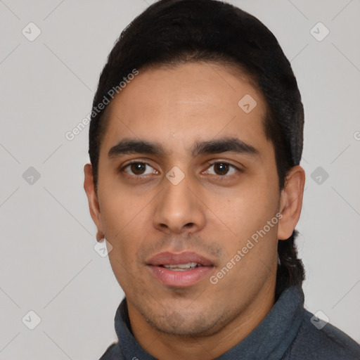 Neutral latino young-adult male with short  black hair and brown eyes