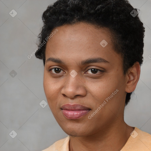 Joyful black young-adult female with short  black hair and brown eyes