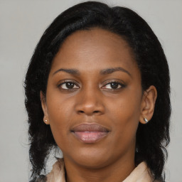 Joyful black young-adult female with medium  brown hair and brown eyes