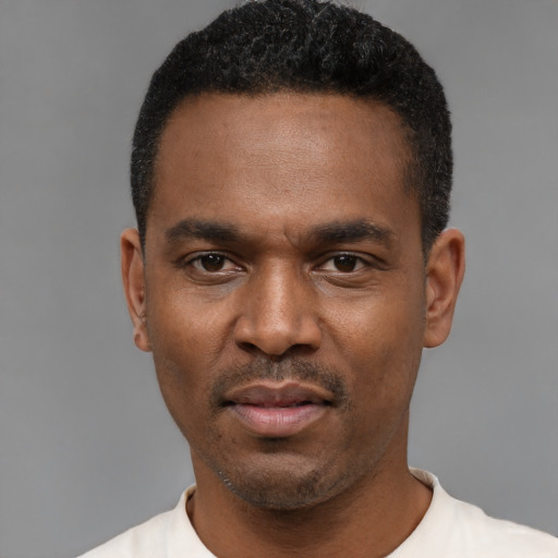 Neutral black young-adult male with short  black hair and brown eyes