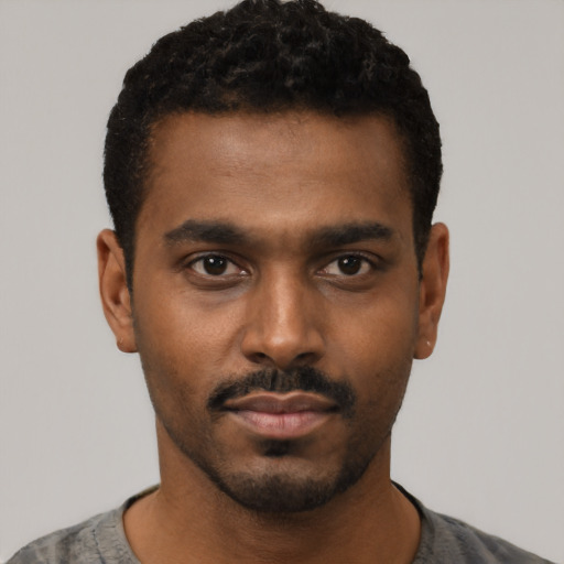 Neutral black young-adult male with short  black hair and brown eyes