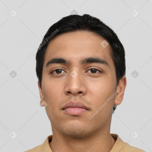 Neutral latino young-adult male with short  black hair and brown eyes