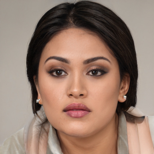 Neutral asian young-adult female with medium  brown hair and brown eyes