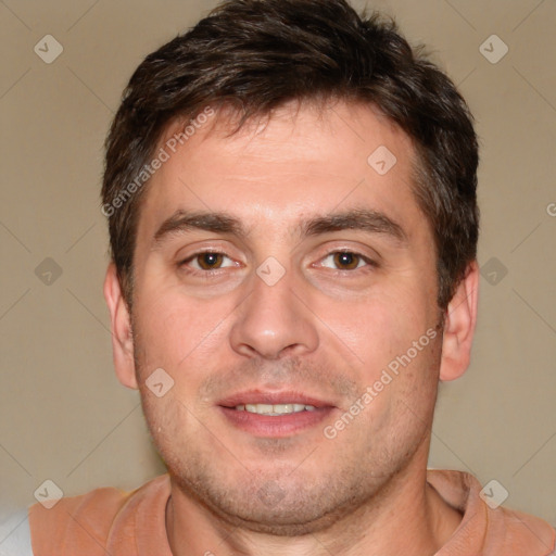 Joyful white adult male with short  brown hair and brown eyes