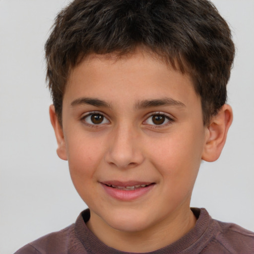 Joyful white child male with short  brown hair and brown eyes