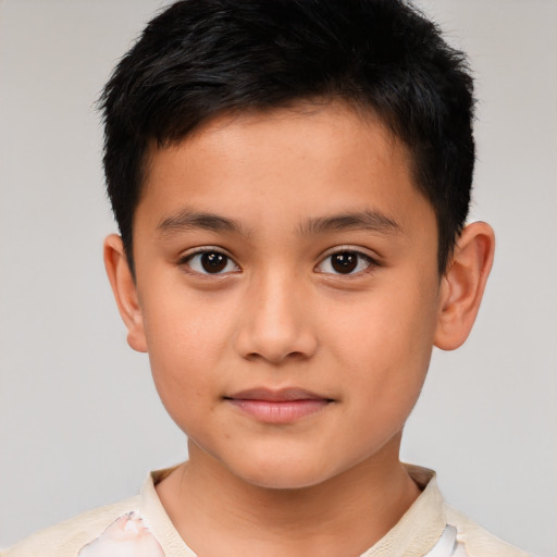 Joyful latino child male with short  brown hair and brown eyes