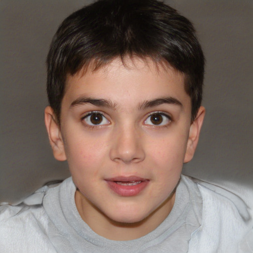 Joyful white child male with short  brown hair and brown eyes