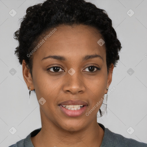 Joyful black young-adult female with short  black hair and brown eyes