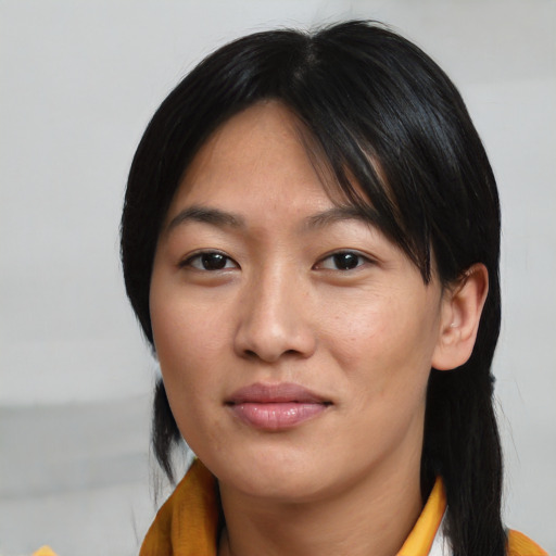 Neutral asian young-adult female with medium  brown hair and brown eyes
