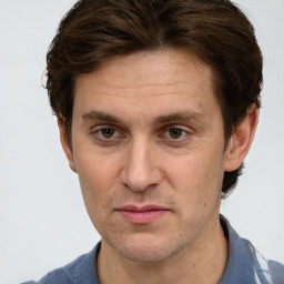 Joyful white adult male with short  brown hair and grey eyes