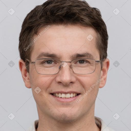 Joyful white adult male with short  brown hair and grey eyes