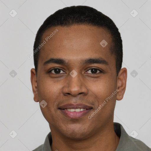 Joyful black young-adult male with short  black hair and brown eyes