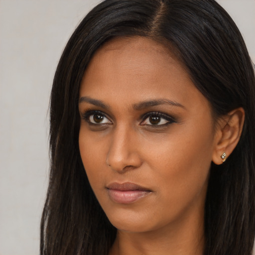 Neutral asian young-adult female with long  brown hair and brown eyes