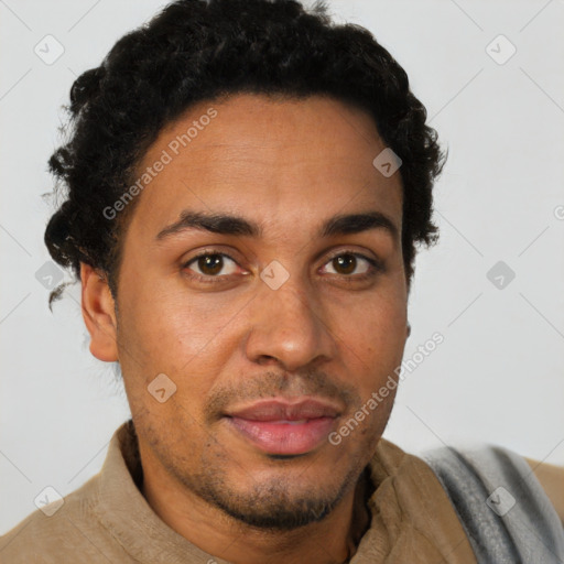 Joyful latino young-adult male with short  brown hair and brown eyes