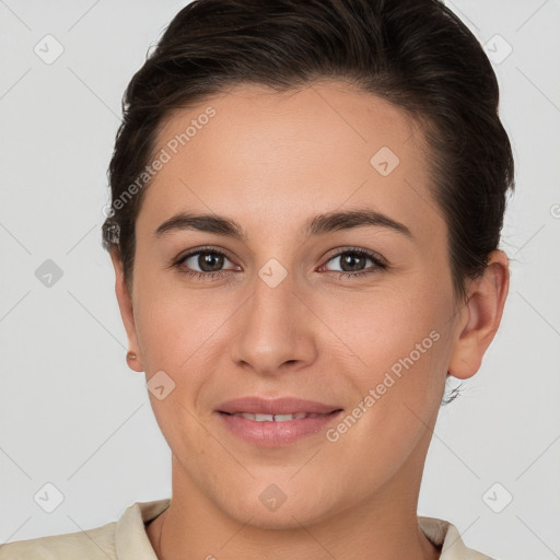 Joyful white young-adult female with short  brown hair and brown eyes