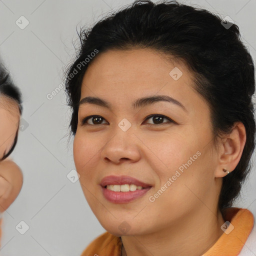 Joyful asian young-adult female with medium  brown hair and brown eyes