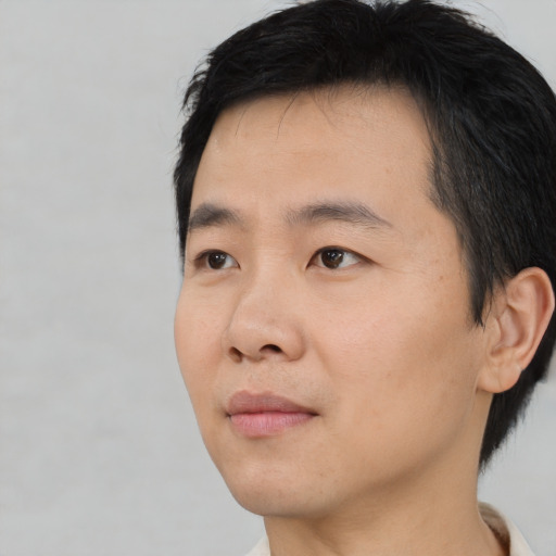 Neutral asian young-adult male with short  black hair and brown eyes
