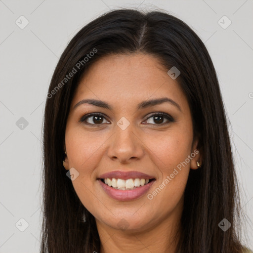 Joyful latino young-adult female with long  brown hair and brown eyes