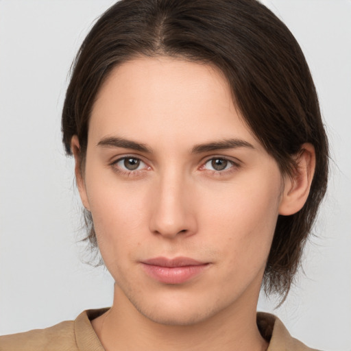 Neutral white young-adult female with medium  brown hair and brown eyes