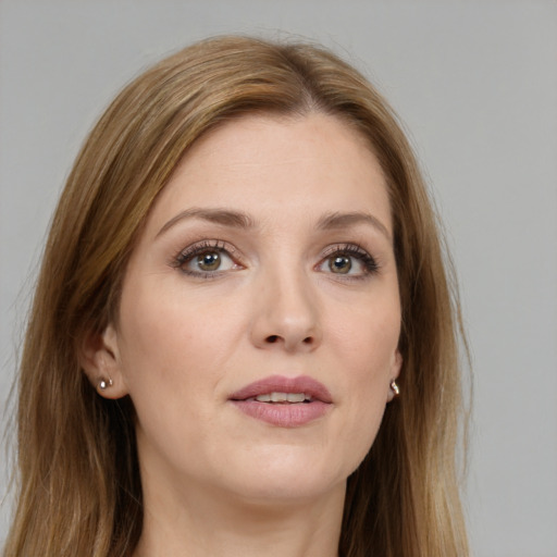 Joyful white young-adult female with long  brown hair and grey eyes