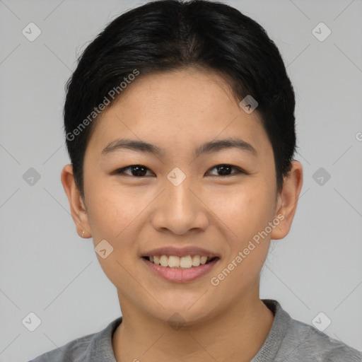 Joyful asian young-adult female with short  black hair and brown eyes