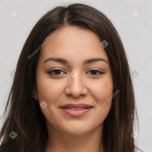 Joyful latino young-adult female with long  brown hair and brown eyes