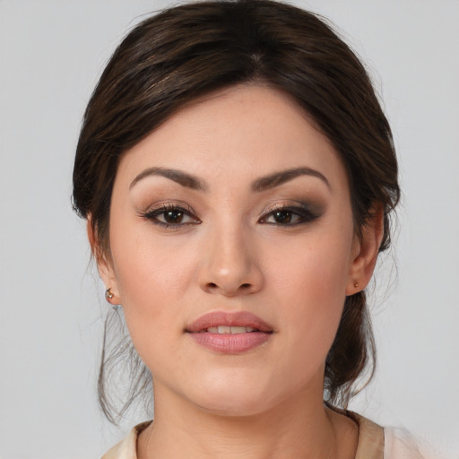 Joyful white young-adult female with medium  brown hair and brown eyes