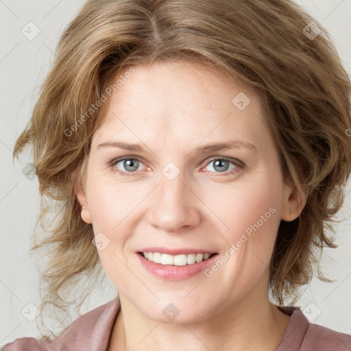 Joyful white young-adult female with medium  brown hair and blue eyes