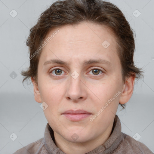 Joyful white adult female with short  brown hair and grey eyes