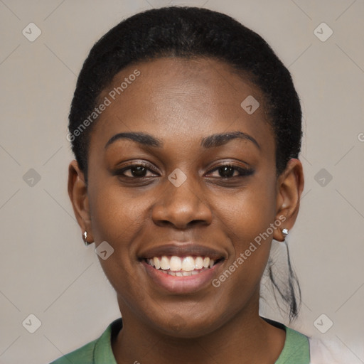 Joyful black young-adult female with short  black hair and brown eyes