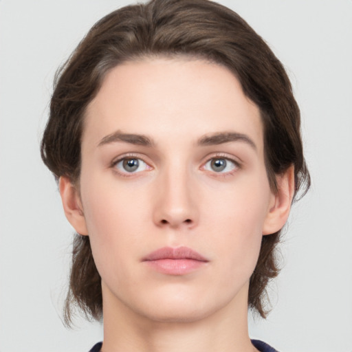 Neutral white young-adult female with short  brown hair and brown eyes