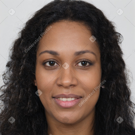 Joyful black young-adult female with long  brown hair and brown eyes