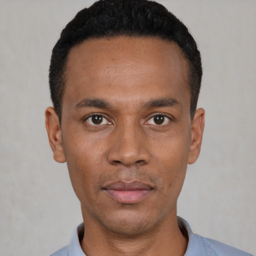 Neutral black young-adult male with short  black hair and brown eyes