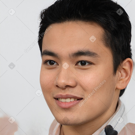 Joyful asian young-adult male with short  brown hair and brown eyes