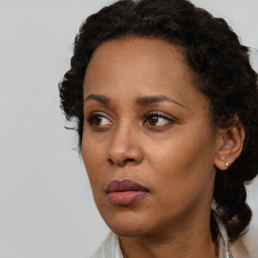 Neutral black adult female with short  black hair and brown eyes