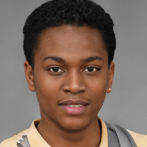 Joyful black young-adult female with short  black hair and brown eyes