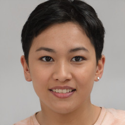 Joyful asian young-adult female with short  brown hair and brown eyes