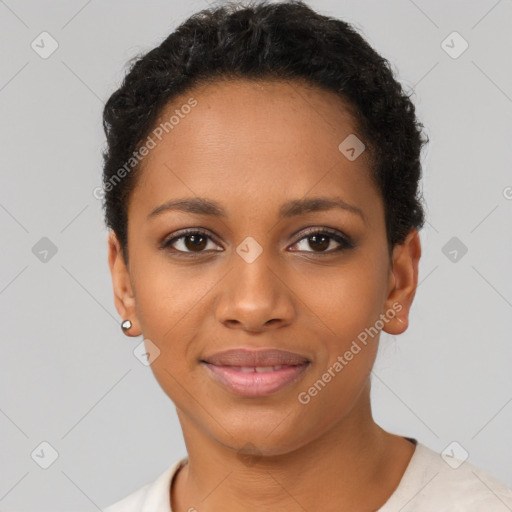 Joyful black young-adult female with short  black hair and brown eyes